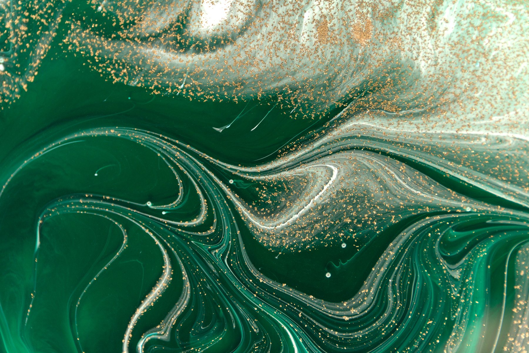 Marbled Green Abstract Background with Golden Sequins. Liquid Marble Ink Pattern.